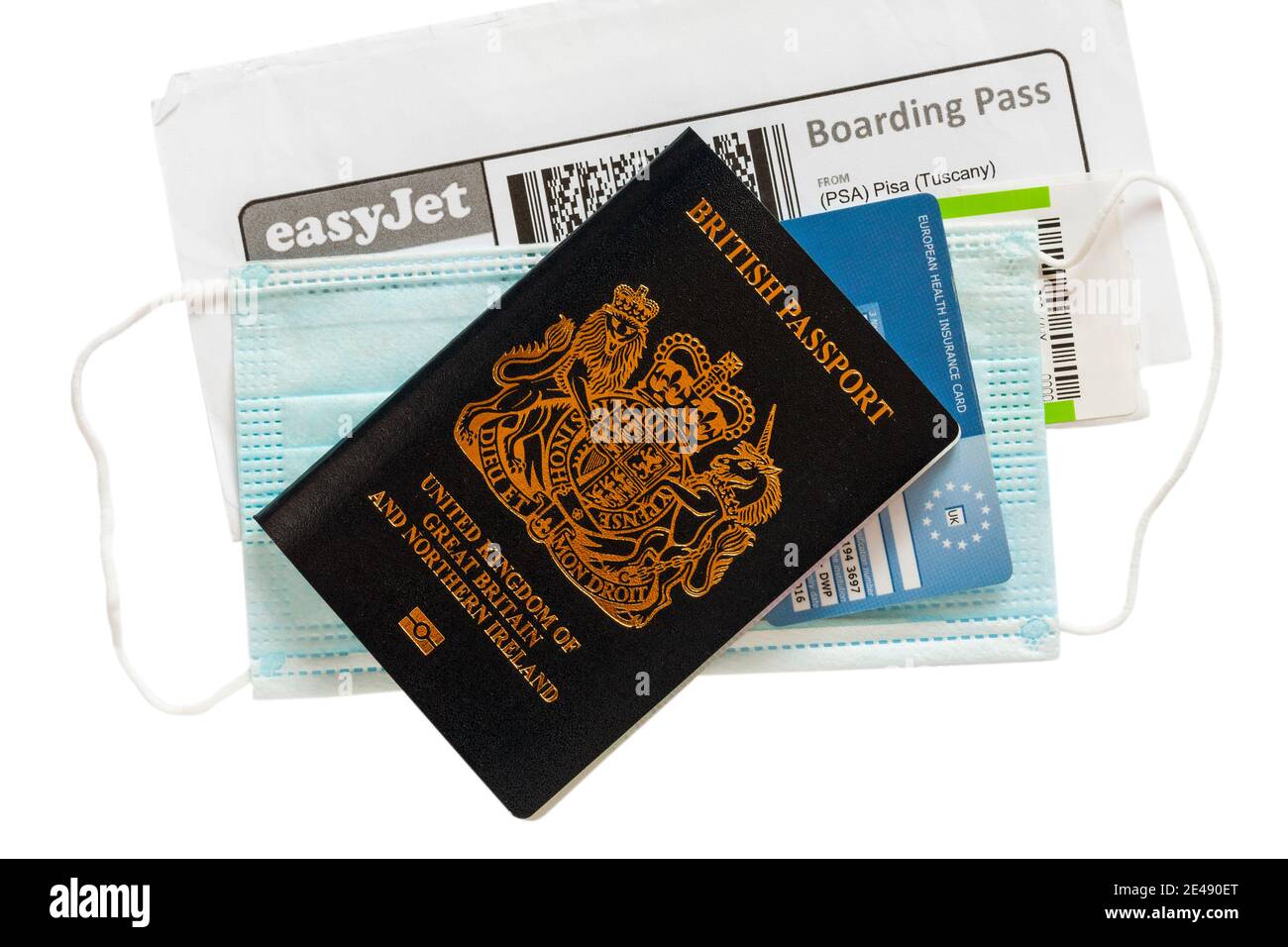 EasyJet boarding pass for flight from Pisa Tuscany with EHIC card and face mask with new British passport set on white background Stock Photo