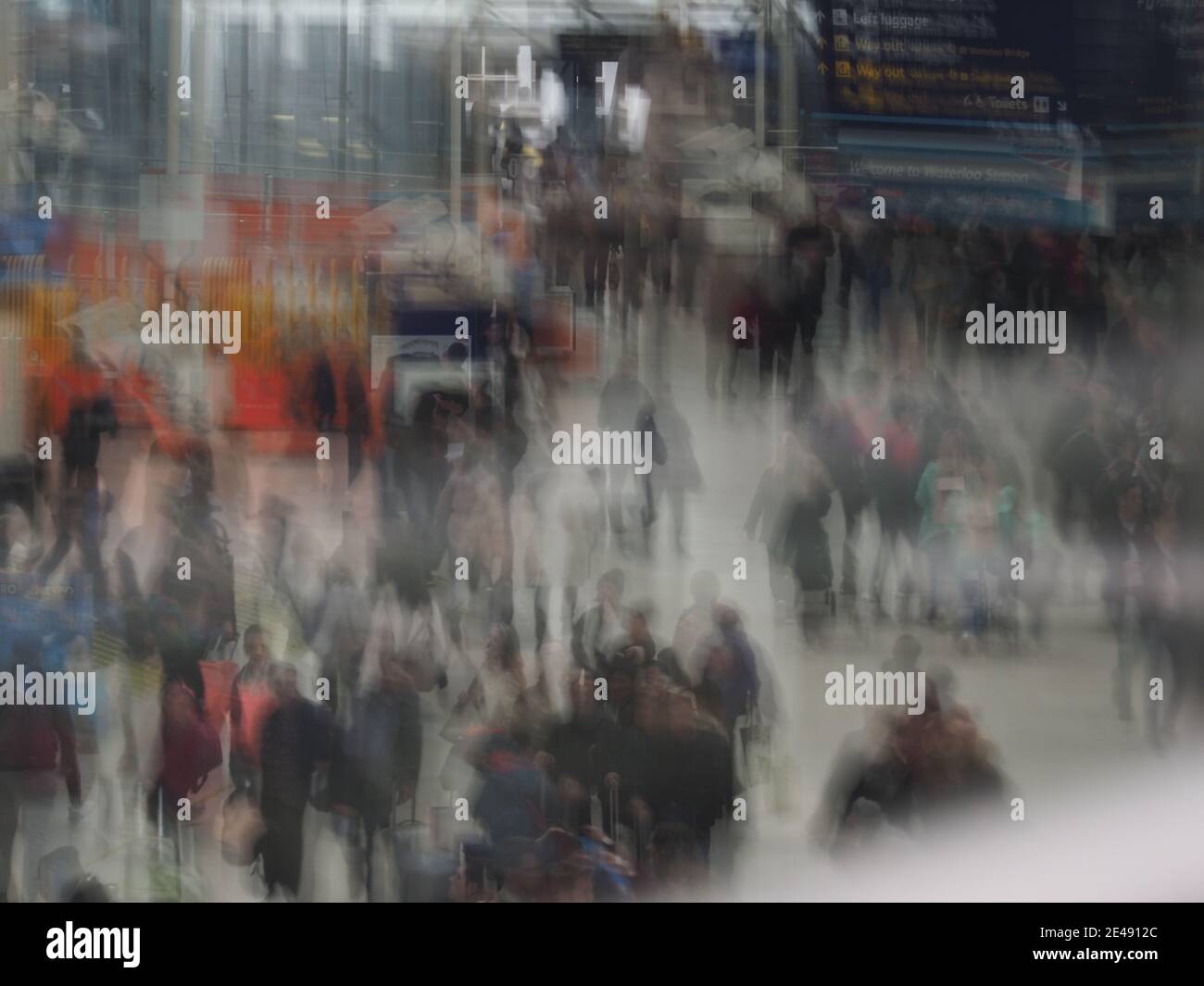semi-abstract deliberately blurred picture of a crowd of people at a railway station Stock Photo