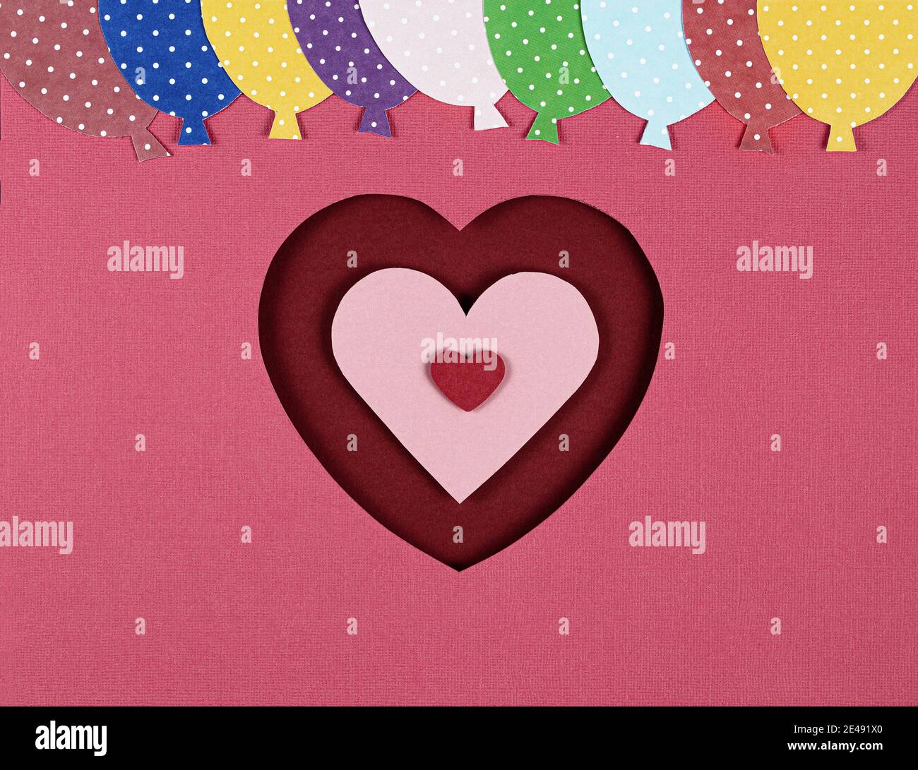 Paper cut in the shape of red heart and balloons on the pink background ...
