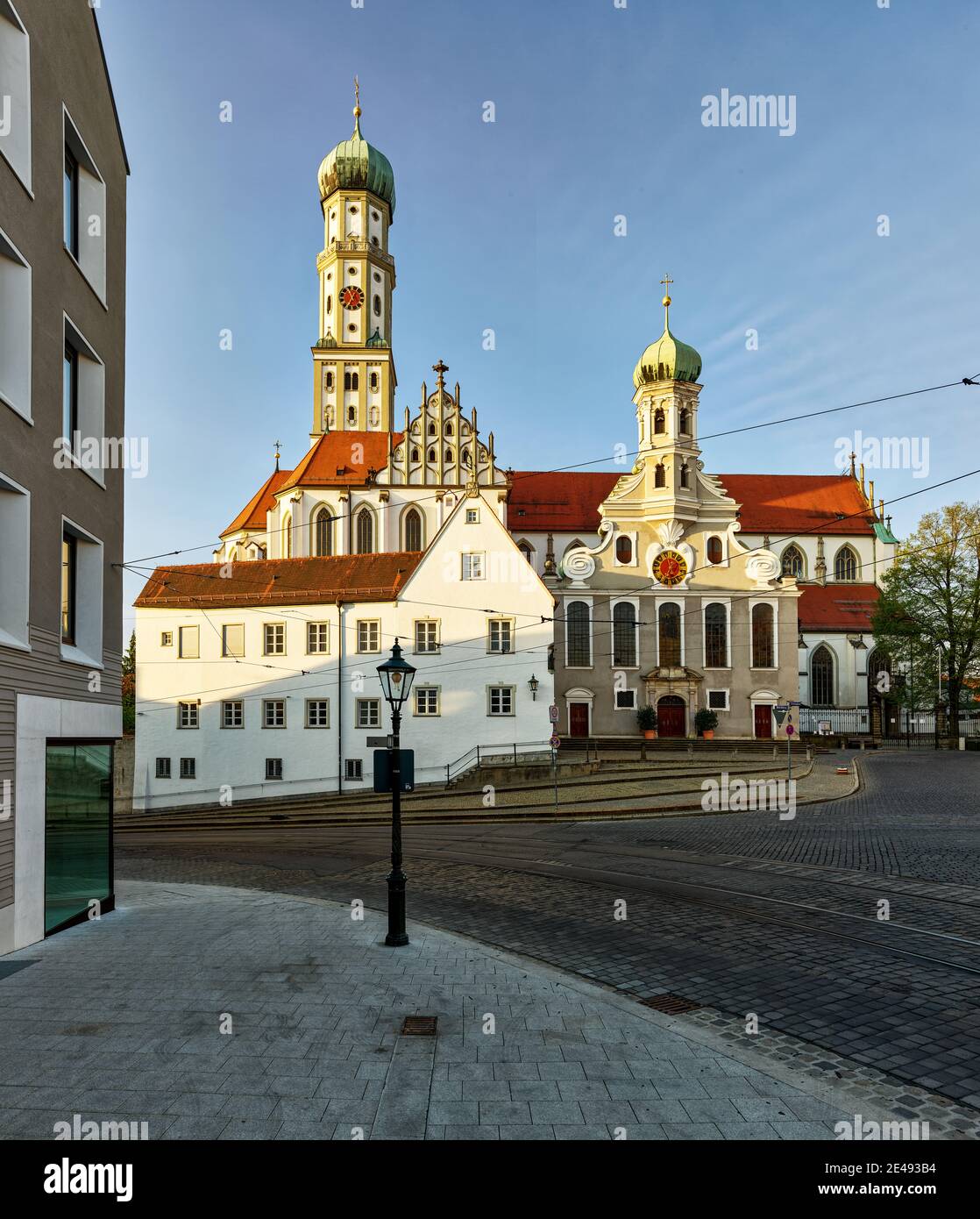 Basilica, Catholic church, Protestant church, street, square, cobblestone pavement, bus stop, house, old town, monument, sight, historic building, listed, dawn, city center - St. Ulrich - cathedral, old town Stock Photo