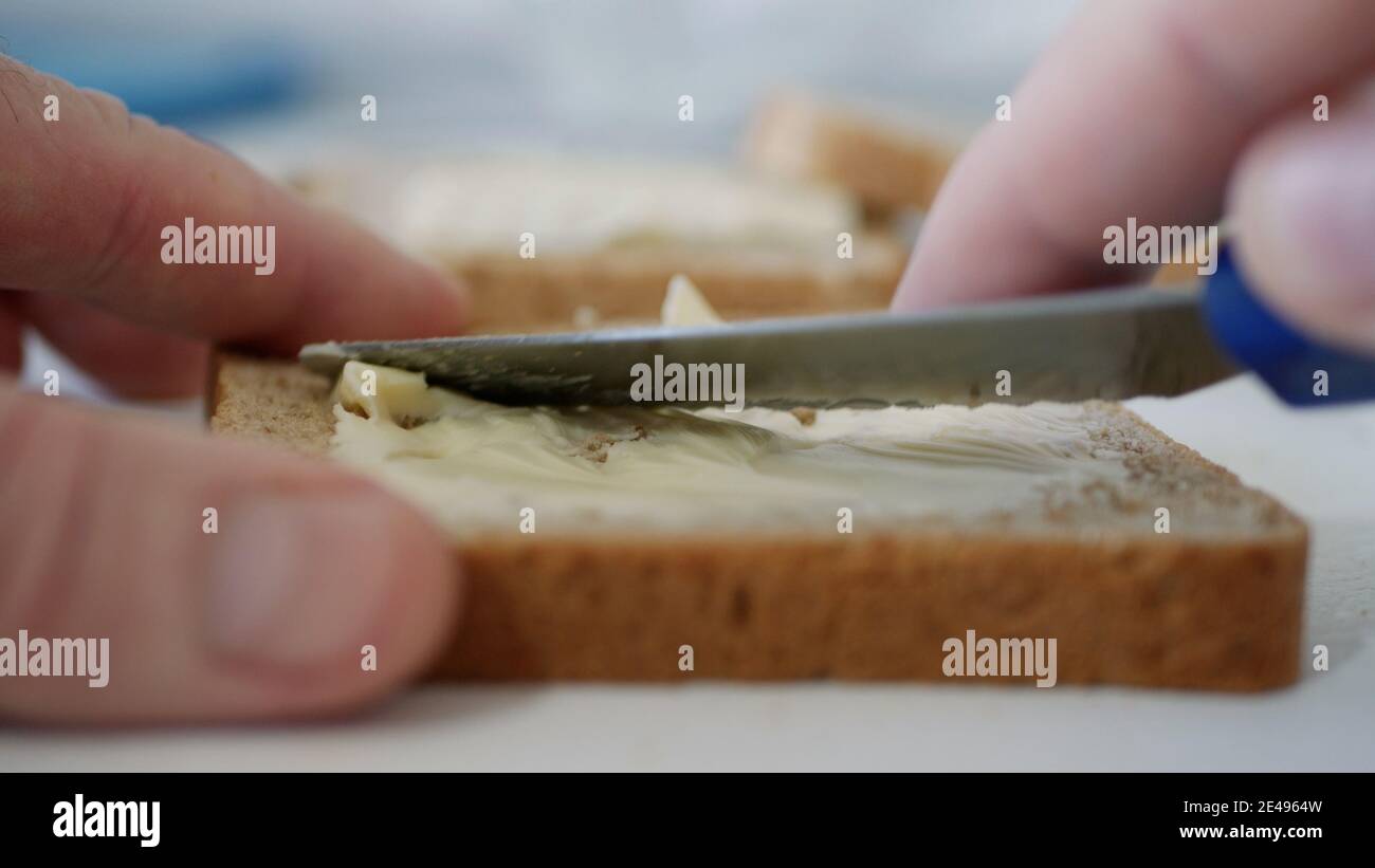 Morning Breakfast with Butter on the Toast, Spreading Margarine on a