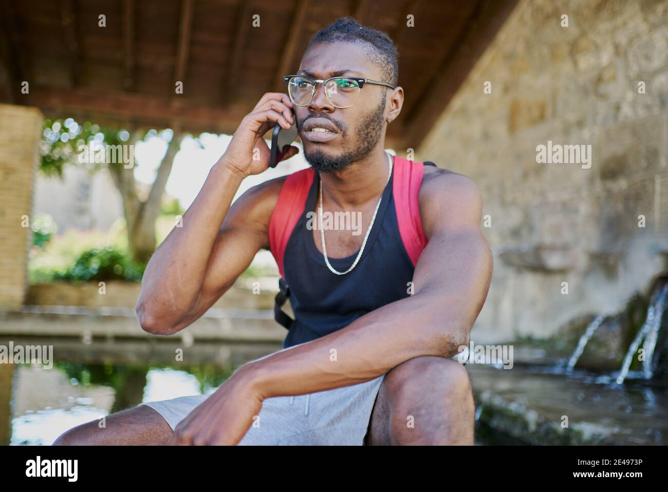 Young man on phone call outdoors Stock Photo