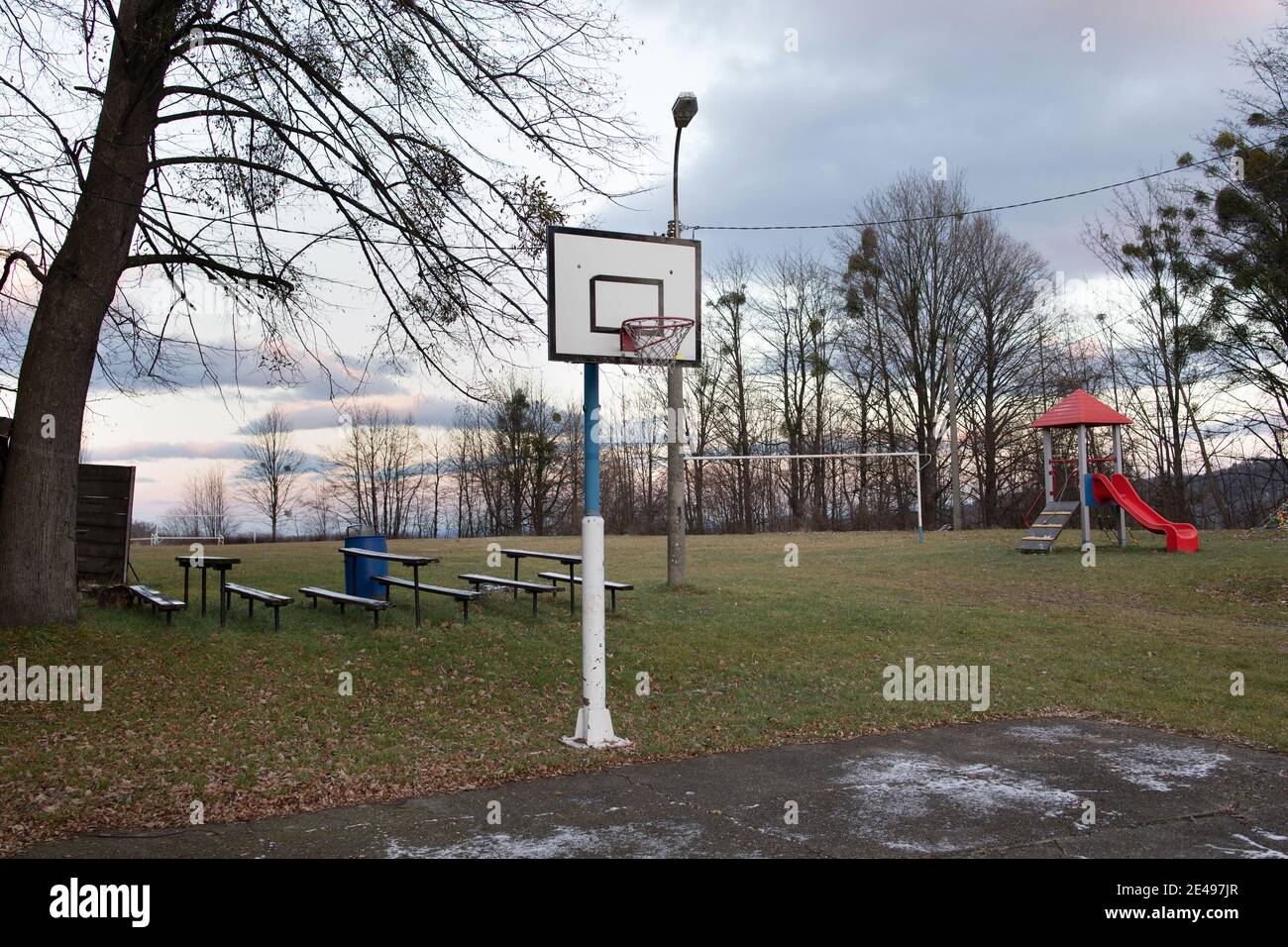 Outdoor basketball court and playground. Playing field in the atumn and