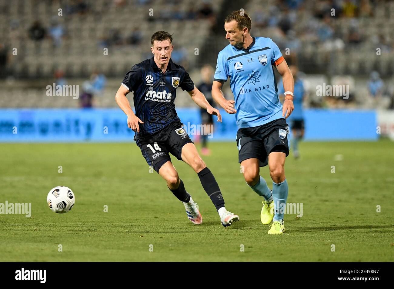22nd January 2021; Jubilee Stadium, New South Wales, Australia; A League Football, Sydney Football Club versus Central Coast Mariners; Alex Wilkinson of Sydney clears the ball as Daniel Bouman of Central Coast Mariners approaches Stock Photo