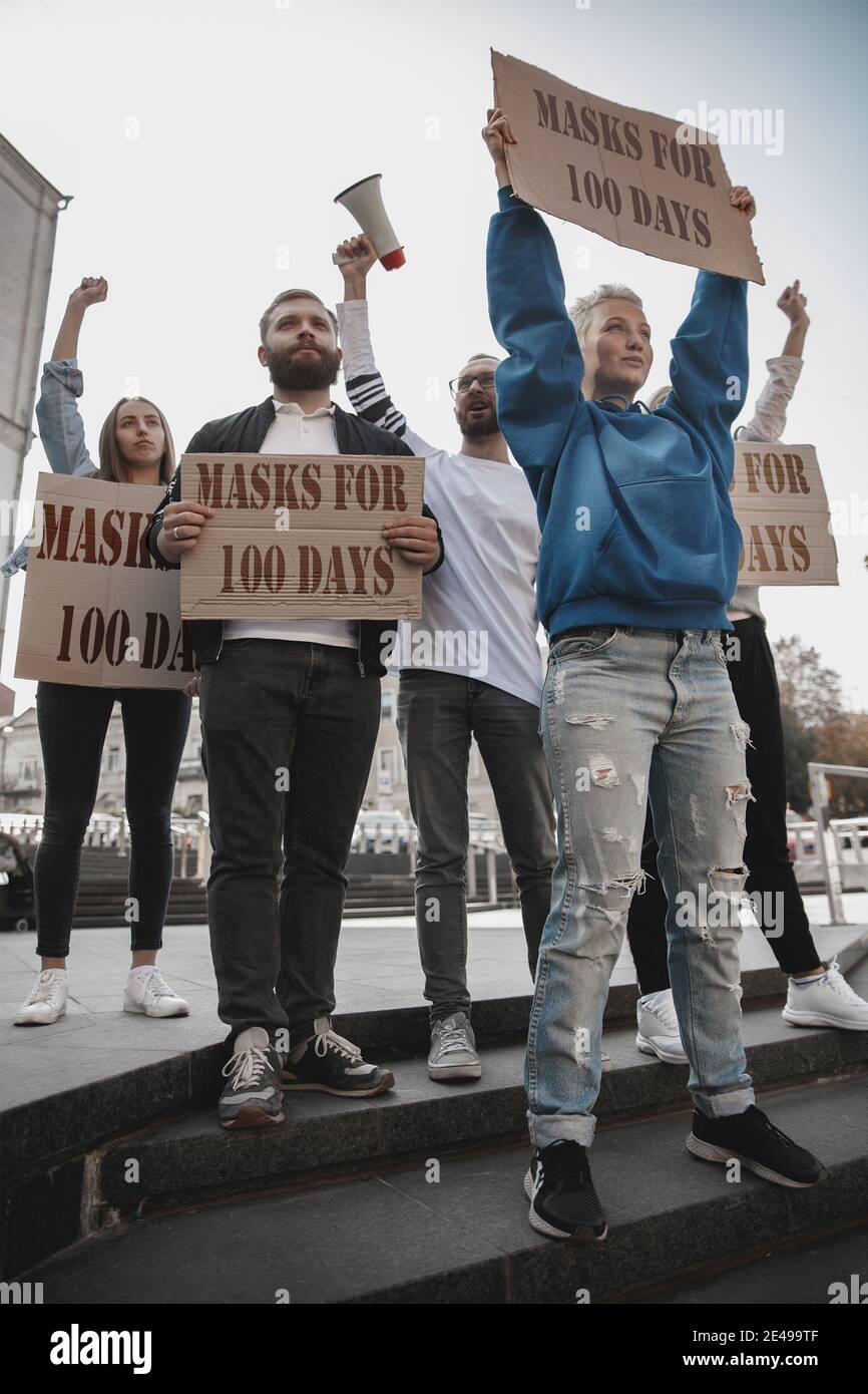 Group of activists protesting, supporting masks for 100 days in America ...