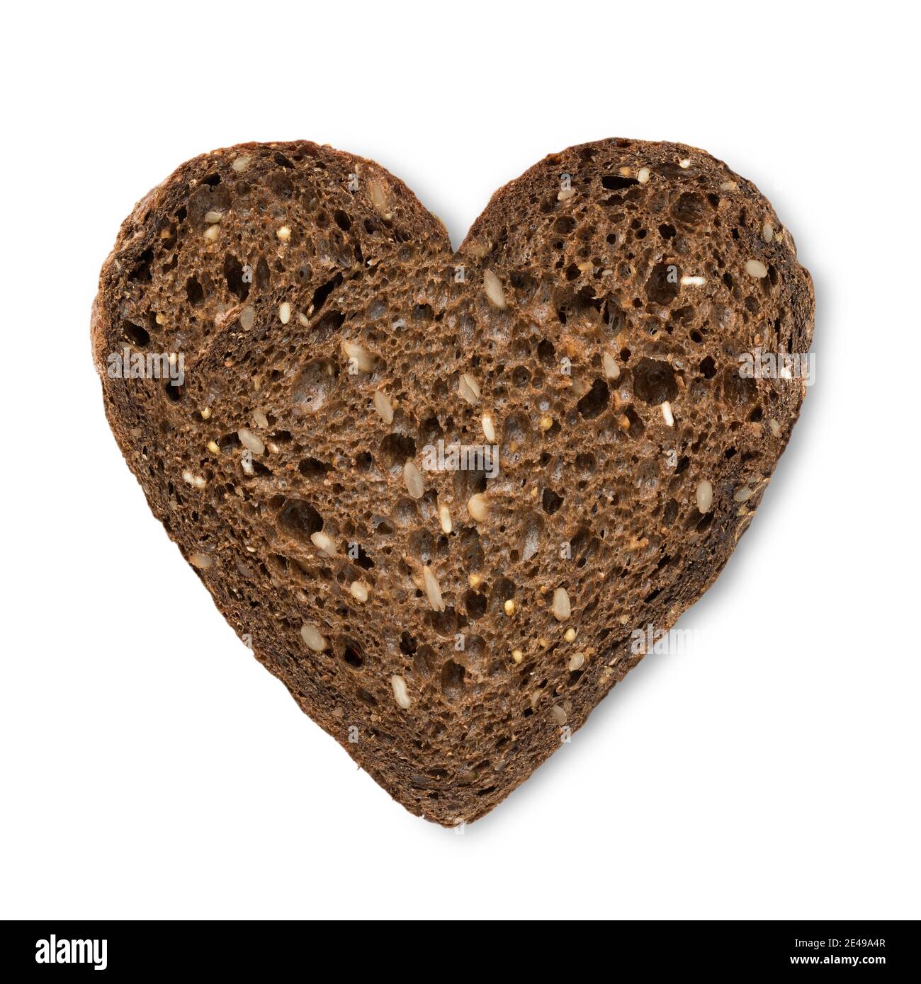 Single heart shaped slice of brown healthy multi grain bread close up