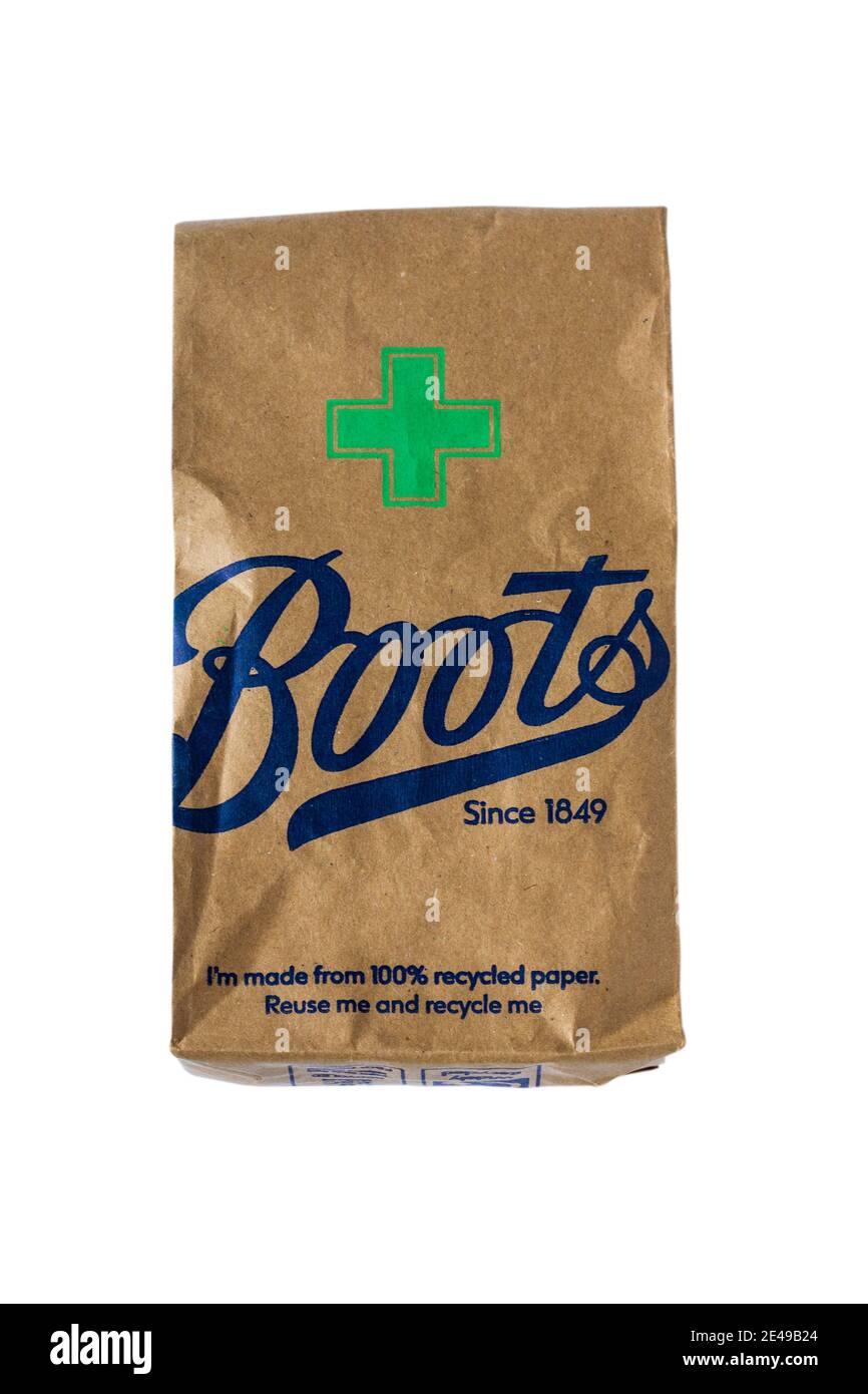 Boots Pharmacy prescription bag now made 100% paper isolated on white background reuse me and recycle me Stock Photo -