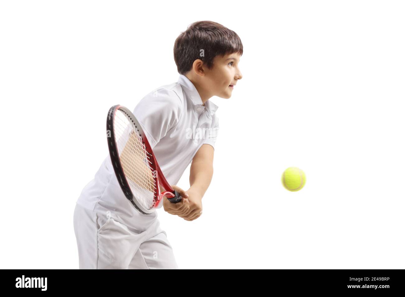Boy hitting a tennis ball isolated on white background Stock Photo Alamy
