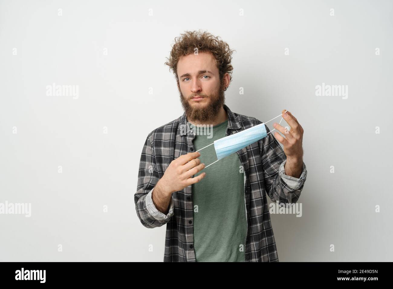 Man holding mask face hi-res stock photography and images - Alamy