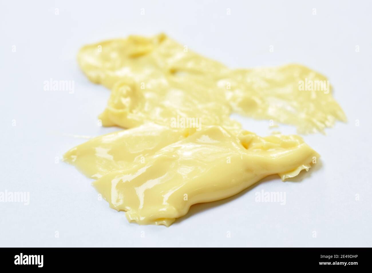 cheese melting down by heat temperature on white background Stock Photo Alamy