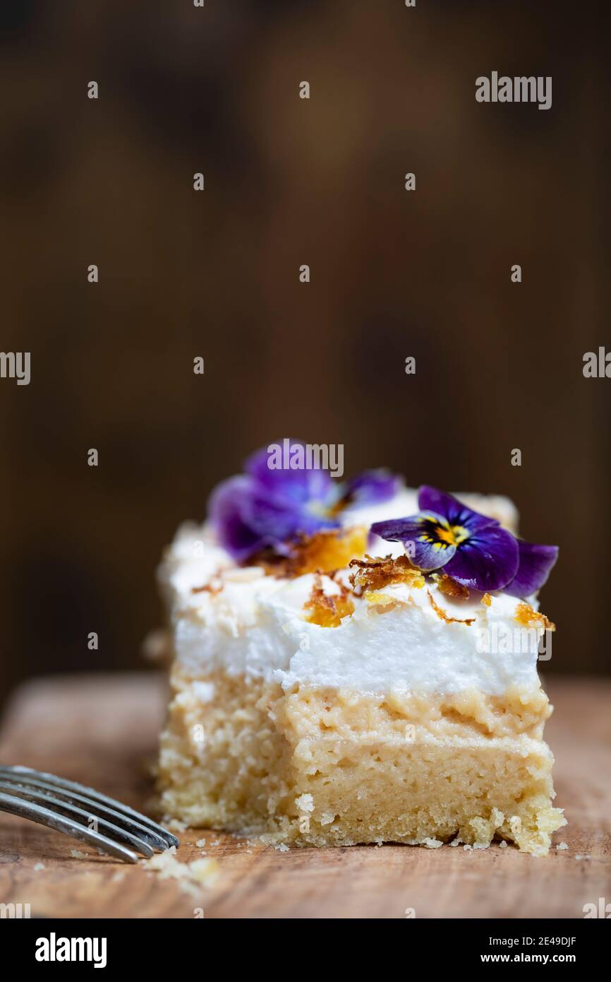 Lemon meringue cake slice with crispy lemon zest Stock Photo