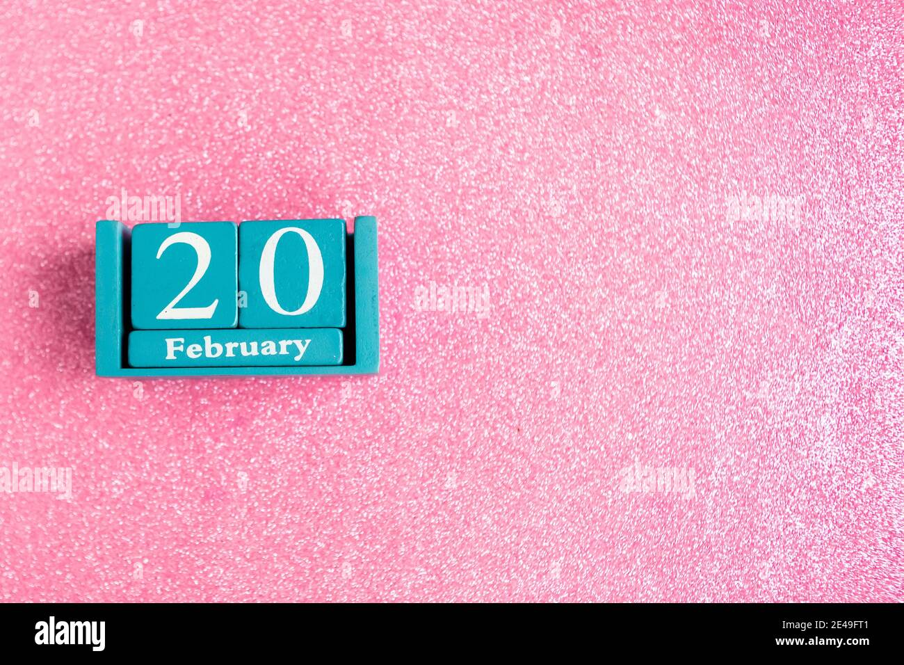 February 20 Blue Cube Calendar With Month And Date On Pink Glitter