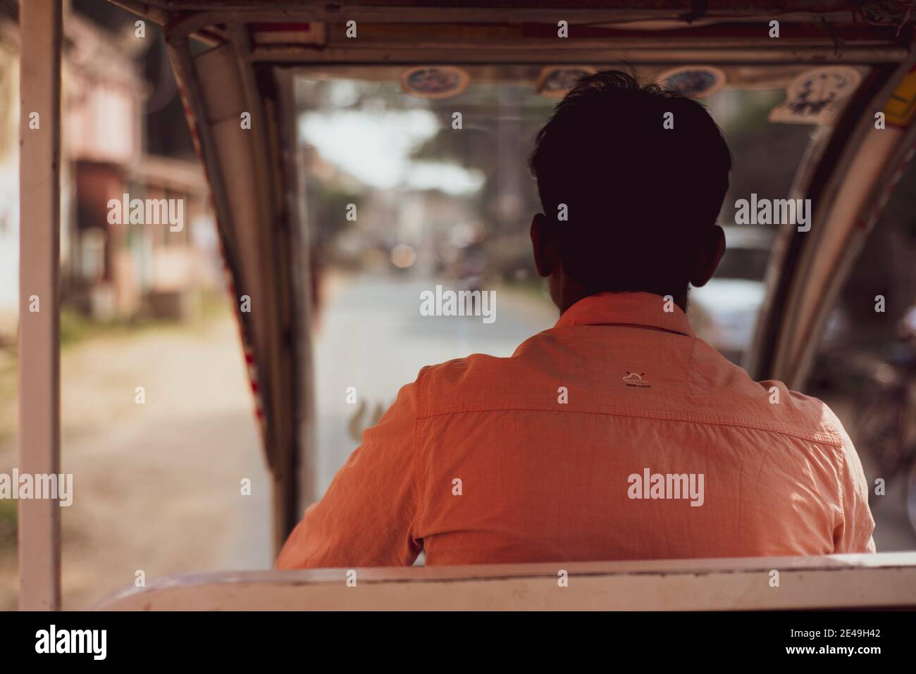 View from behind through autorickshaw taxi drivers window in India Stock Photo