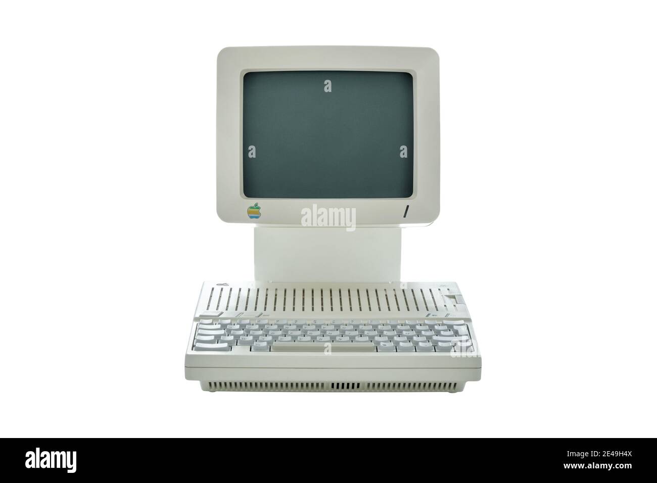 Vintage classic Apple desktop computer from the eighties with integrated monitor and keyboard isolated on white background Stock Photo