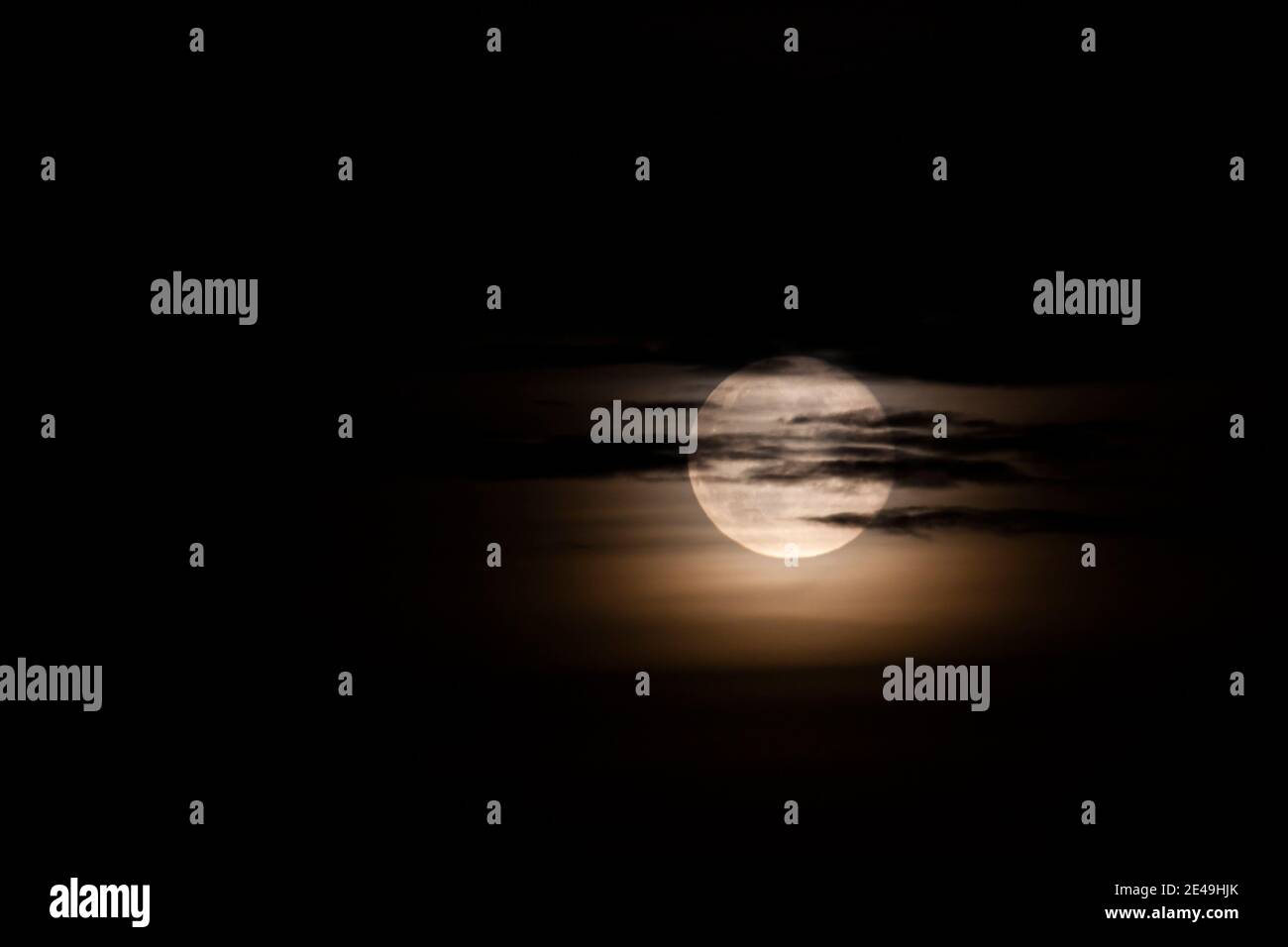 Dramatic Full Moon through clouds at Night Stock Photo - Alamy