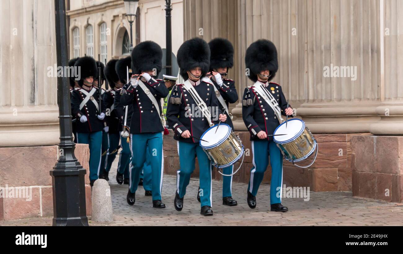 Copenhagen, Denmark - 12 Dec 2020: Members of Danish Royal Life guards marching in front of the Amalienborg Palace, home of the Danish royal family, d Stock Photo