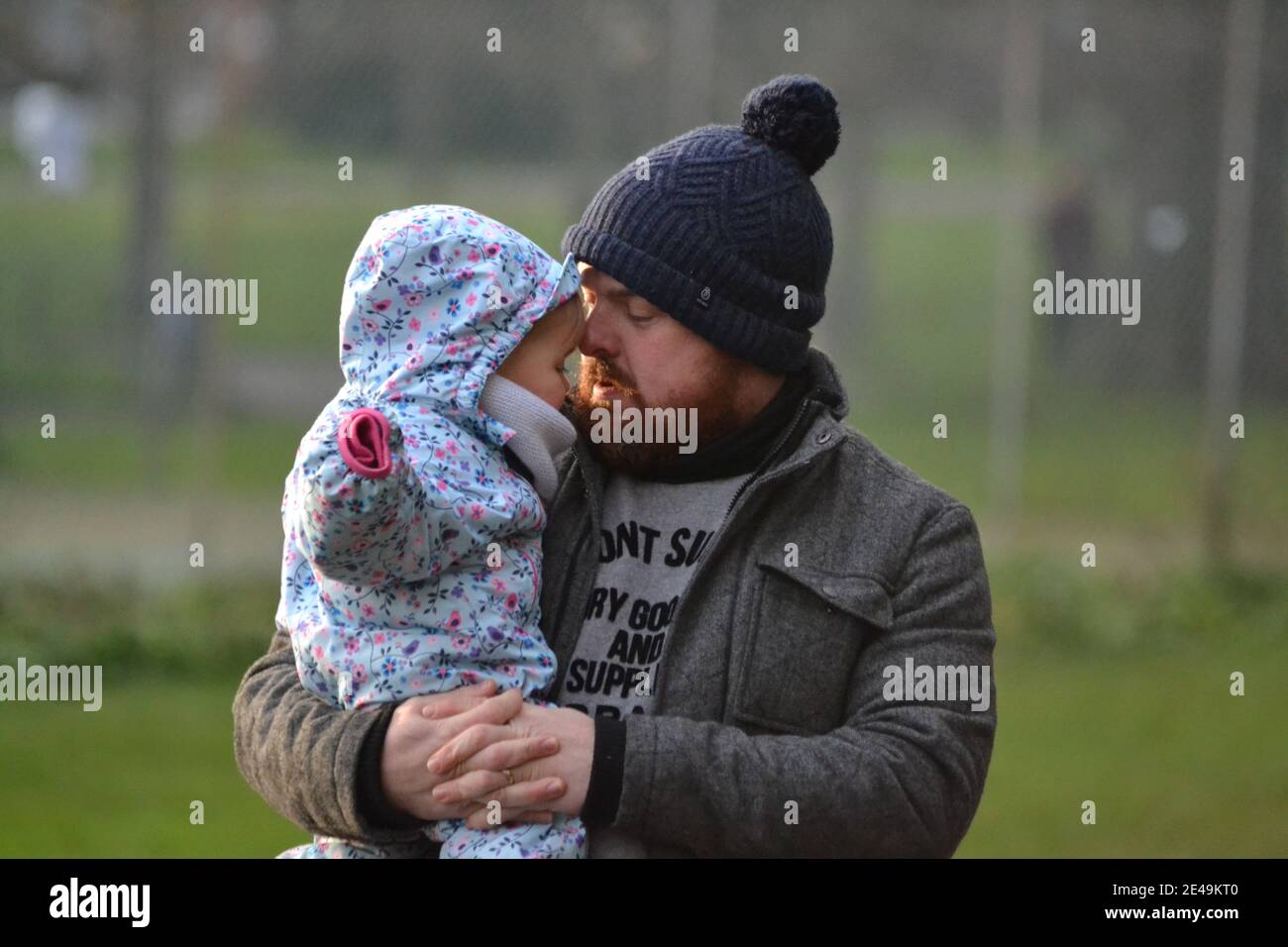 Father And Daughter Time At The Park - Hugging - Wrapped Up For Winter ...