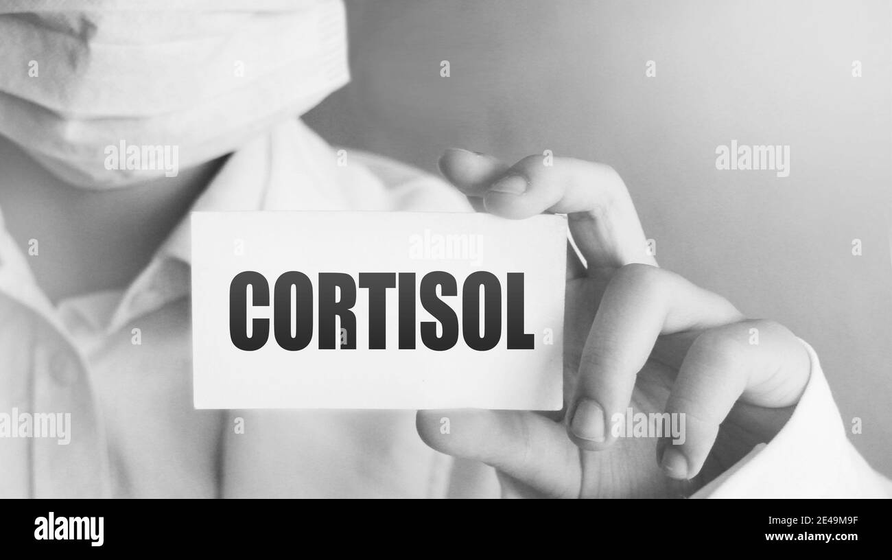 Doctor's Hand with white card with Cortisol word. Immune System Healthcare medical Concept. Stock Photo