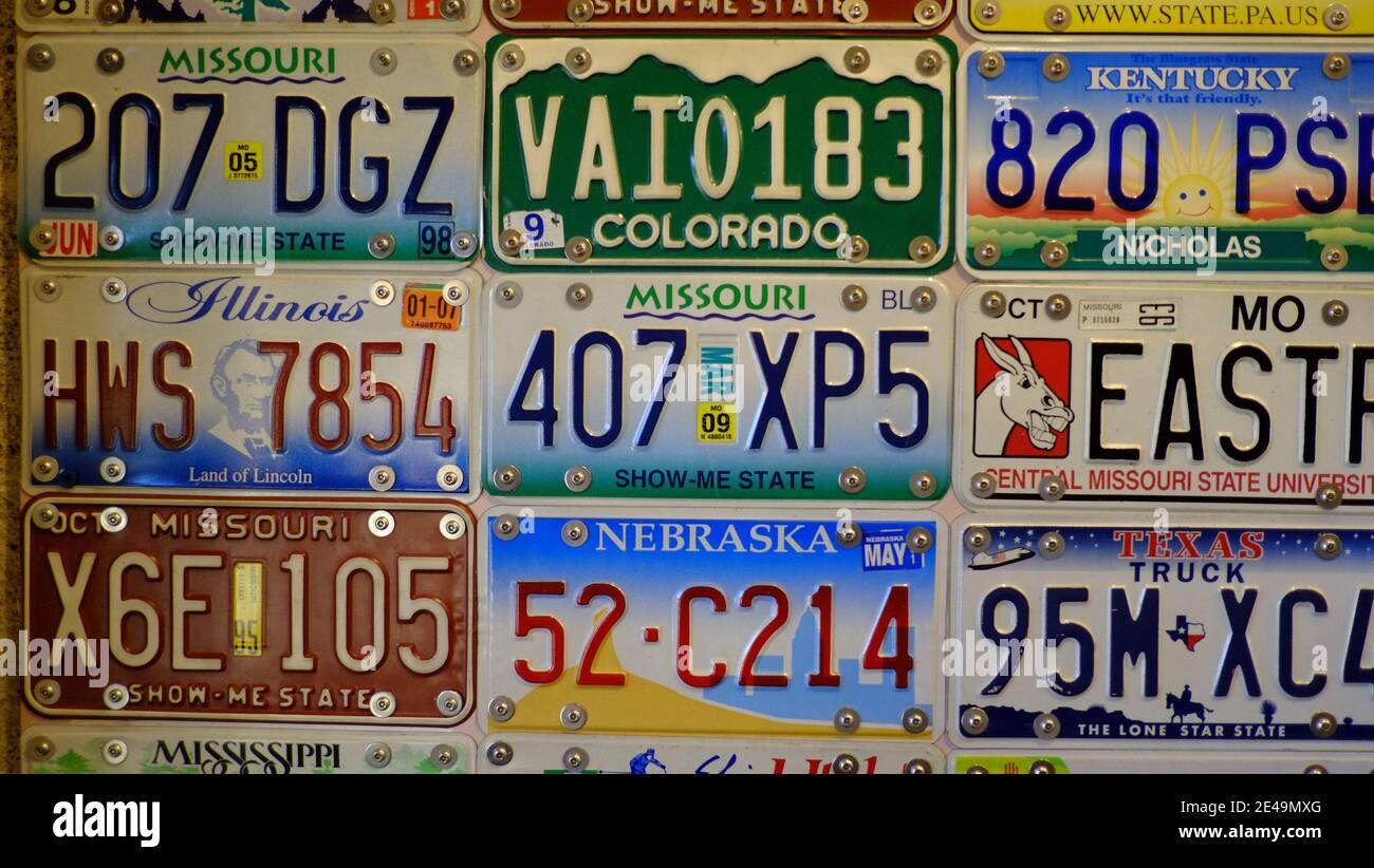 License plates from various US states decorate the walls of a Missouri rest area Stock Photo