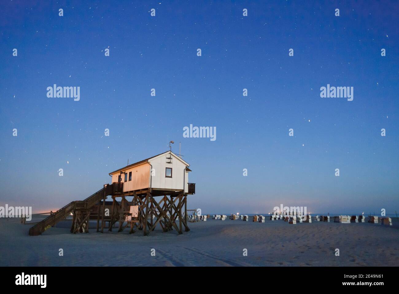 Stilt house on the beach of st peter ording hires stock photography