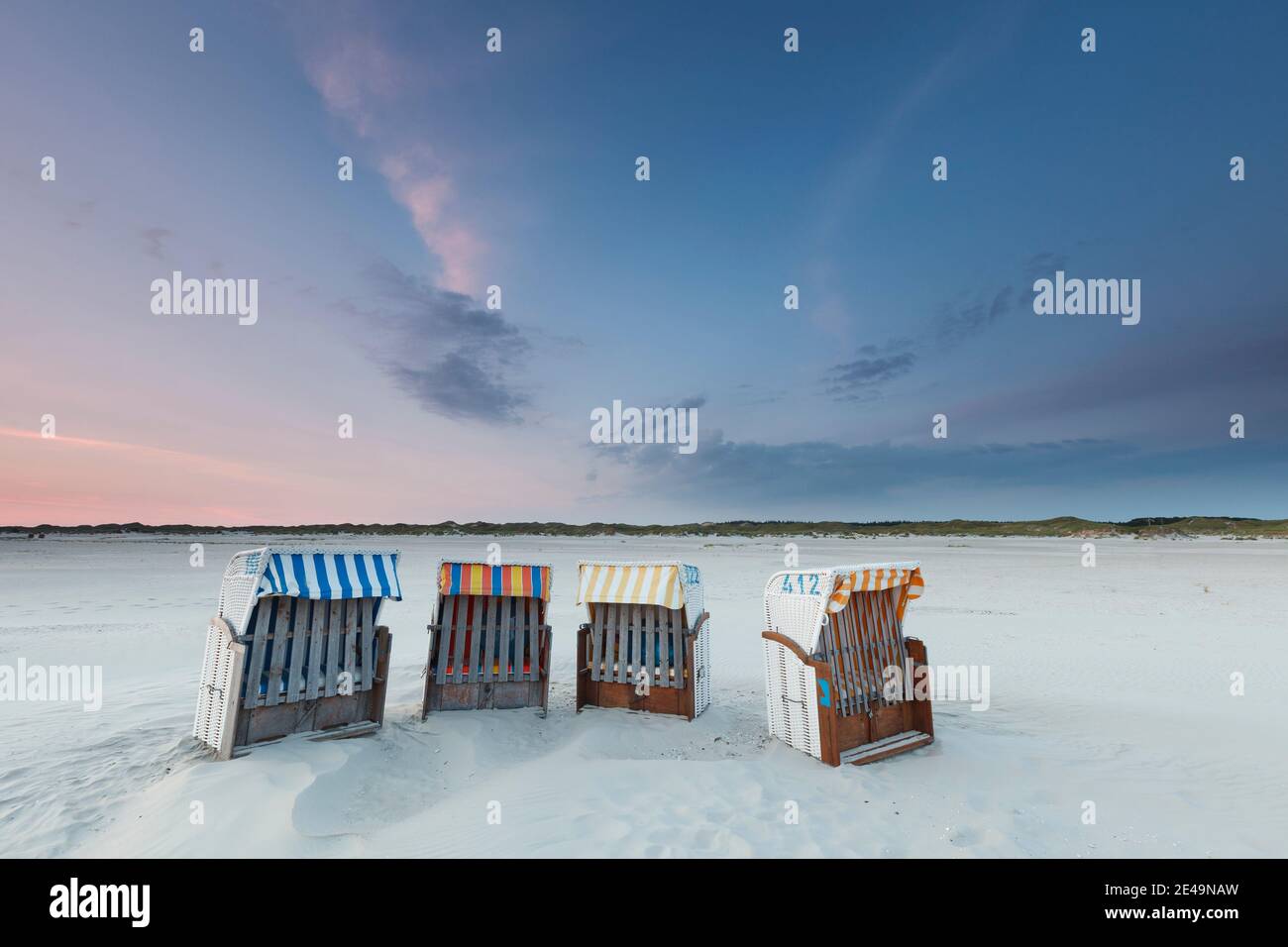 Beach chairs in the blue hours on the beach of Nebel on the island of Amrum in North Friesland, Schleswig-Holstein, Germany Stock Photo