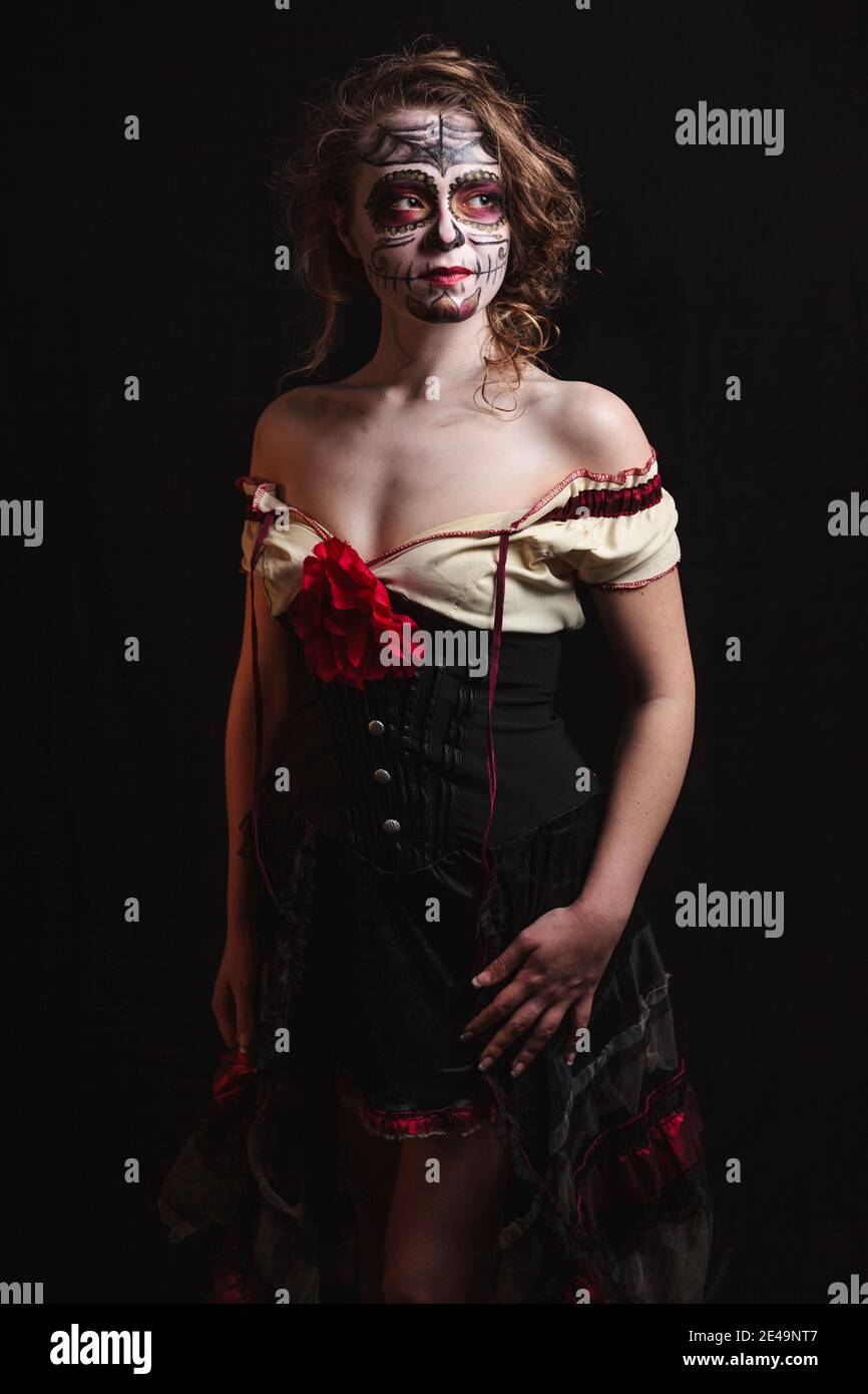 Portrait of young woman make up and masked like dia des los muertos style, mexican tradition, day of the dead, bodypainting, Stock Photo