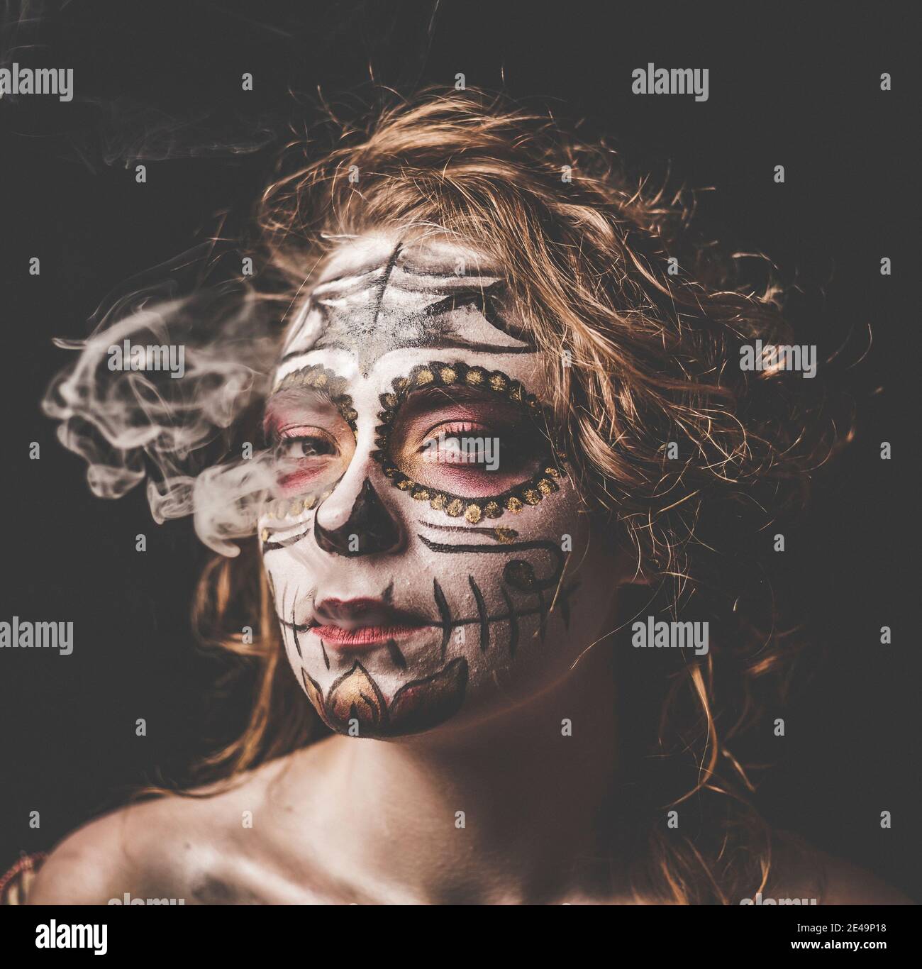 Portrait of young woman make up and masked like dia des los muertos style, mexican tradition, day of the dead, bodypainting, Stock Photo