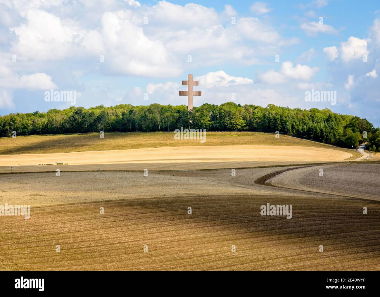 The large Cross of Lorraine of Charles de Gaulle Memorial dominates a rolling countryside landscape from the top of a hill. Stock Photo