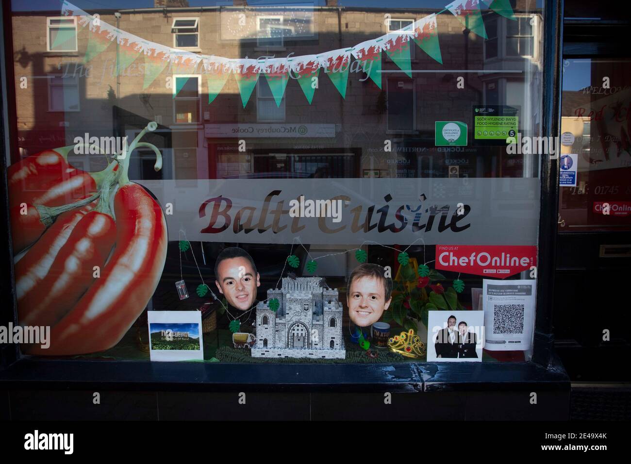A shop front in Abergele, north Wales, decorated in tribute to the television show I'm A Celebrity Get Me Out Of Here, which is being filmed in Gwrych Castle on the outskirts of the town. There have been reports that non-native species of insects such as cockroaches have escaped from the set and found their way into the local environment. Stock Photo