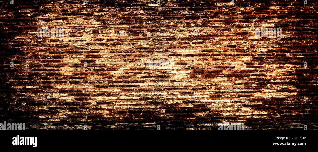 Weathered stained old brick wall background. Background of brick wall texture Stock Photo