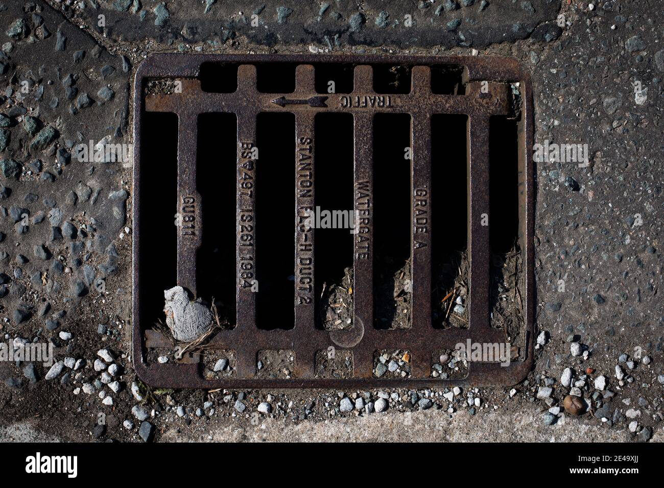 A drain cover pictured on a street in Wirral, England. Stock Photo