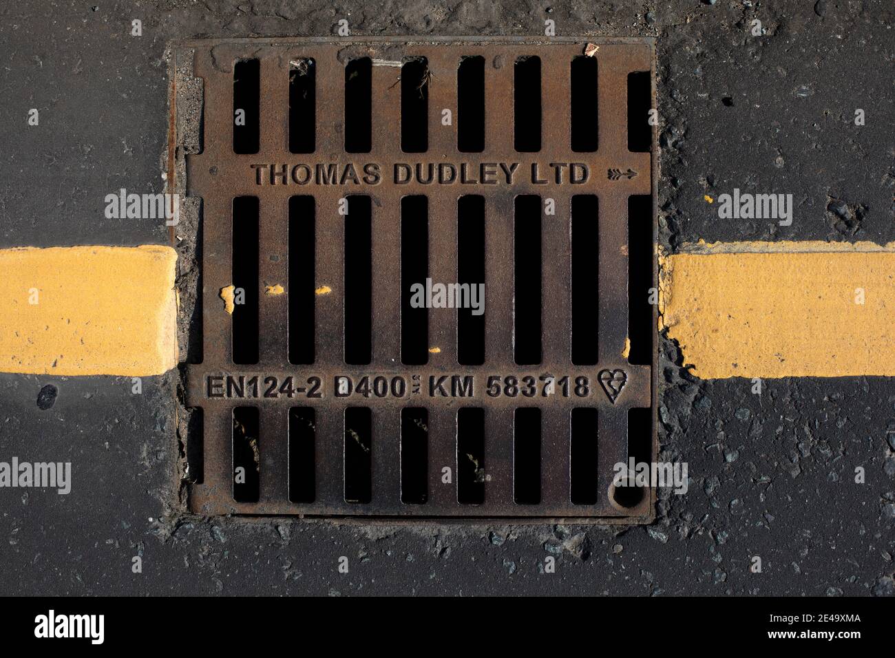 A drain cover pictured on a street in Wirral, England. Stock Photo