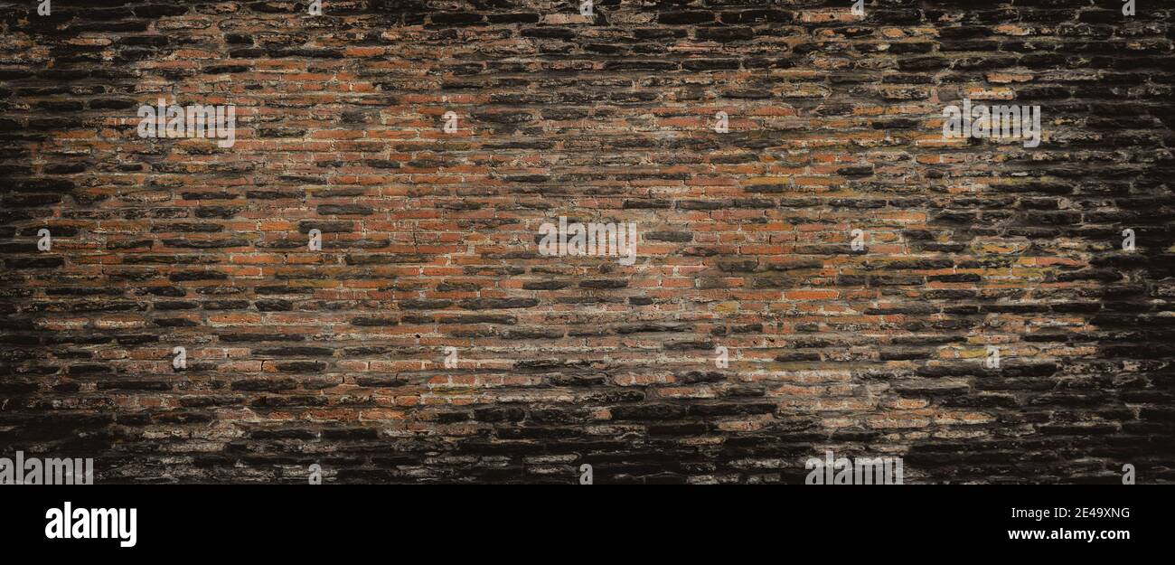 Weathered stained old brick wall background. Background of brick wall texture Stock Photo