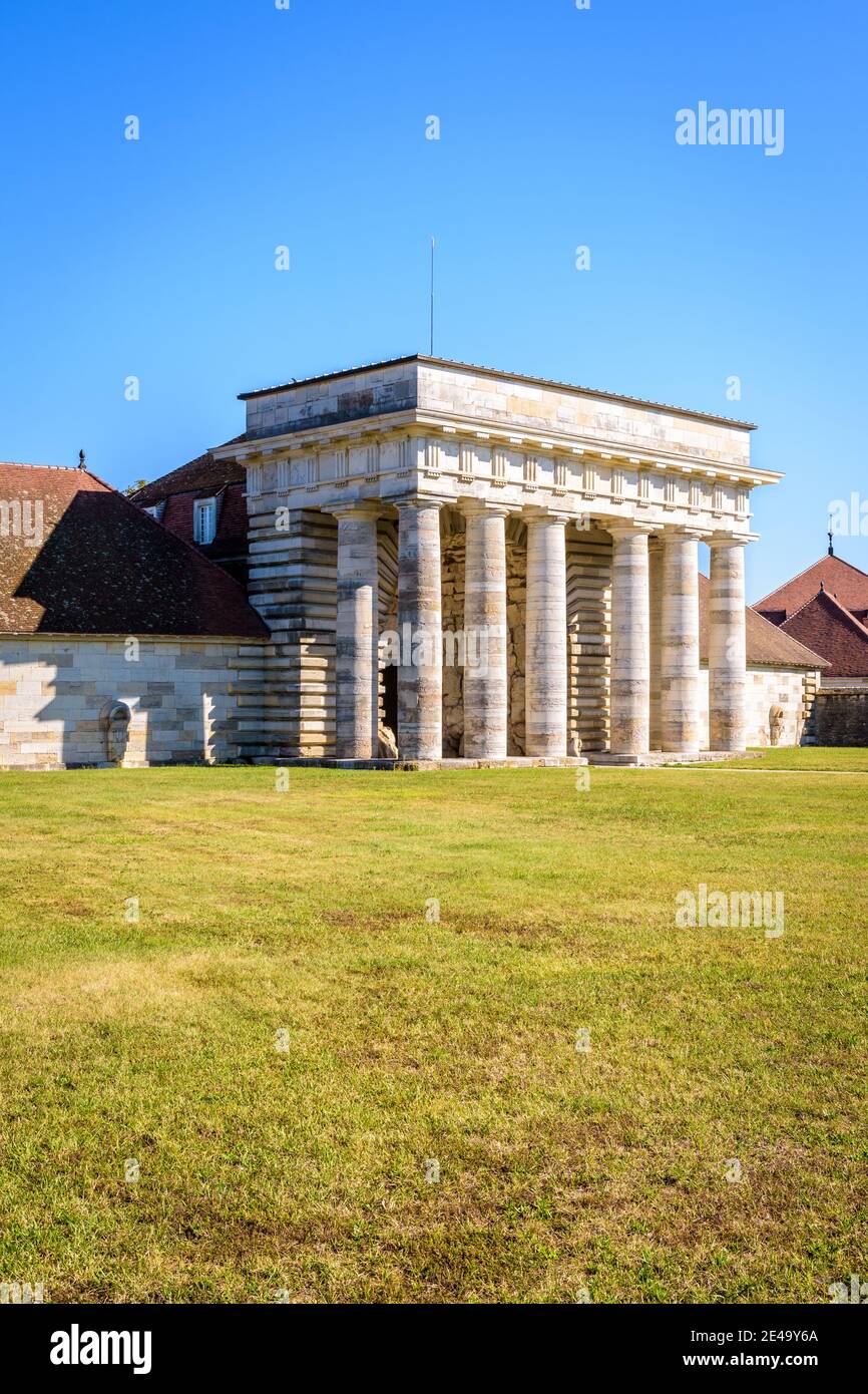 Entrance to the Royal Saltworks site in Arc-et-Senans by the former Guards building with a neoclassical portico. Stock Photo