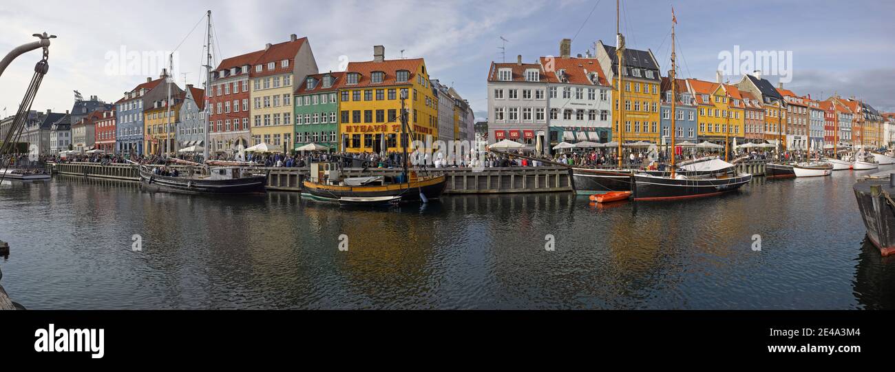 Buildings along a canal with boats, Nyhavn, Copenhagen, Denmark Stock Photo