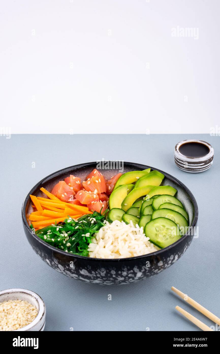 An overhead photo of poke bowl, traditional Hawaiian and Japanise raw ...