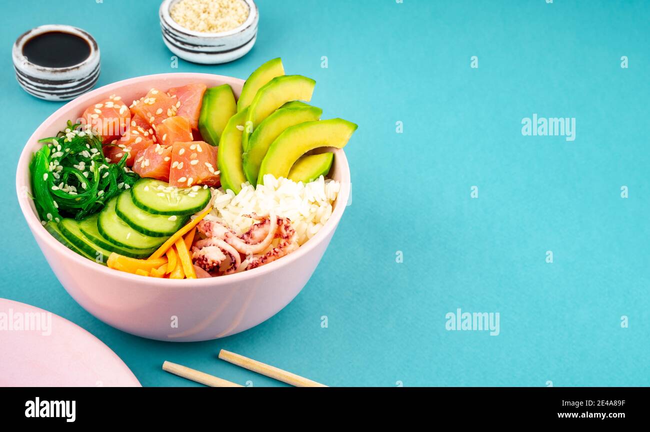 An overhead photo of poke bowl, traditional Hawaiian and Japanise raw ...