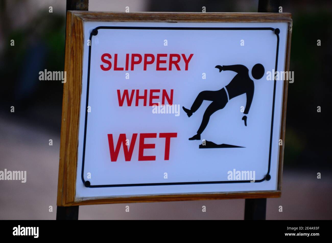 warning sign at pool Slippery When Wet Stock Photo