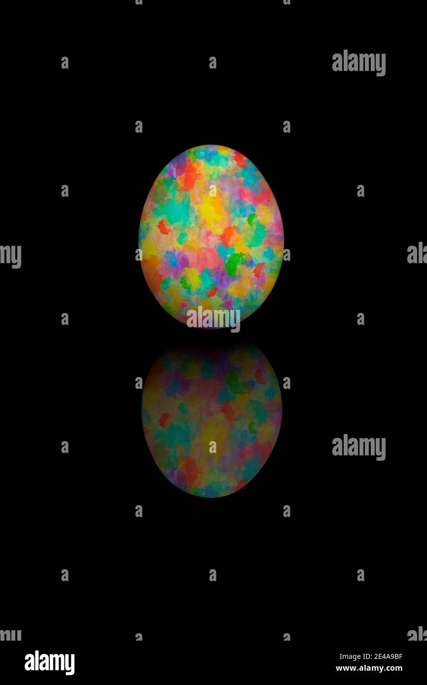Easter egg painted with different colors, isolated on black bakcground. Stock Photo