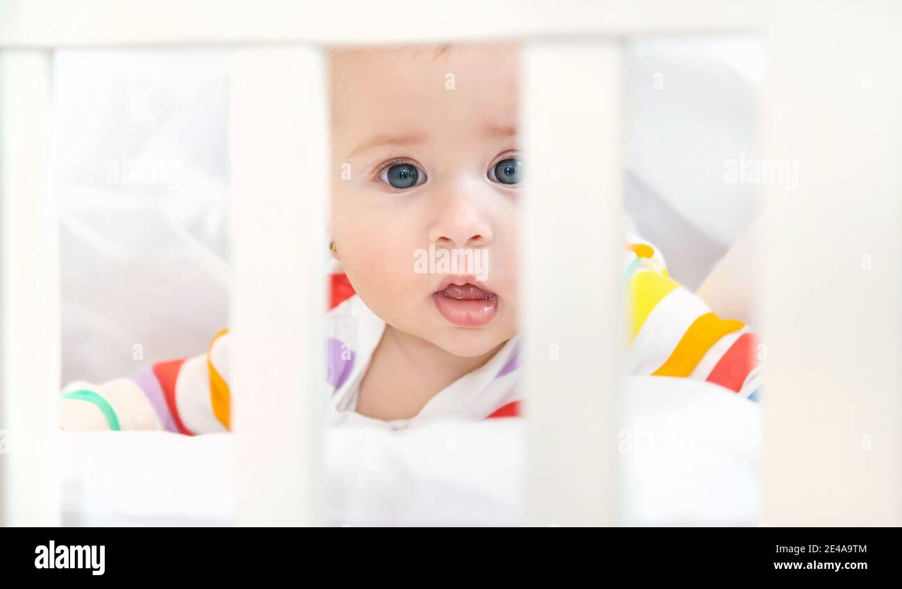 The baby in the crib goes to bed. Selective focus. People Stock Photo
