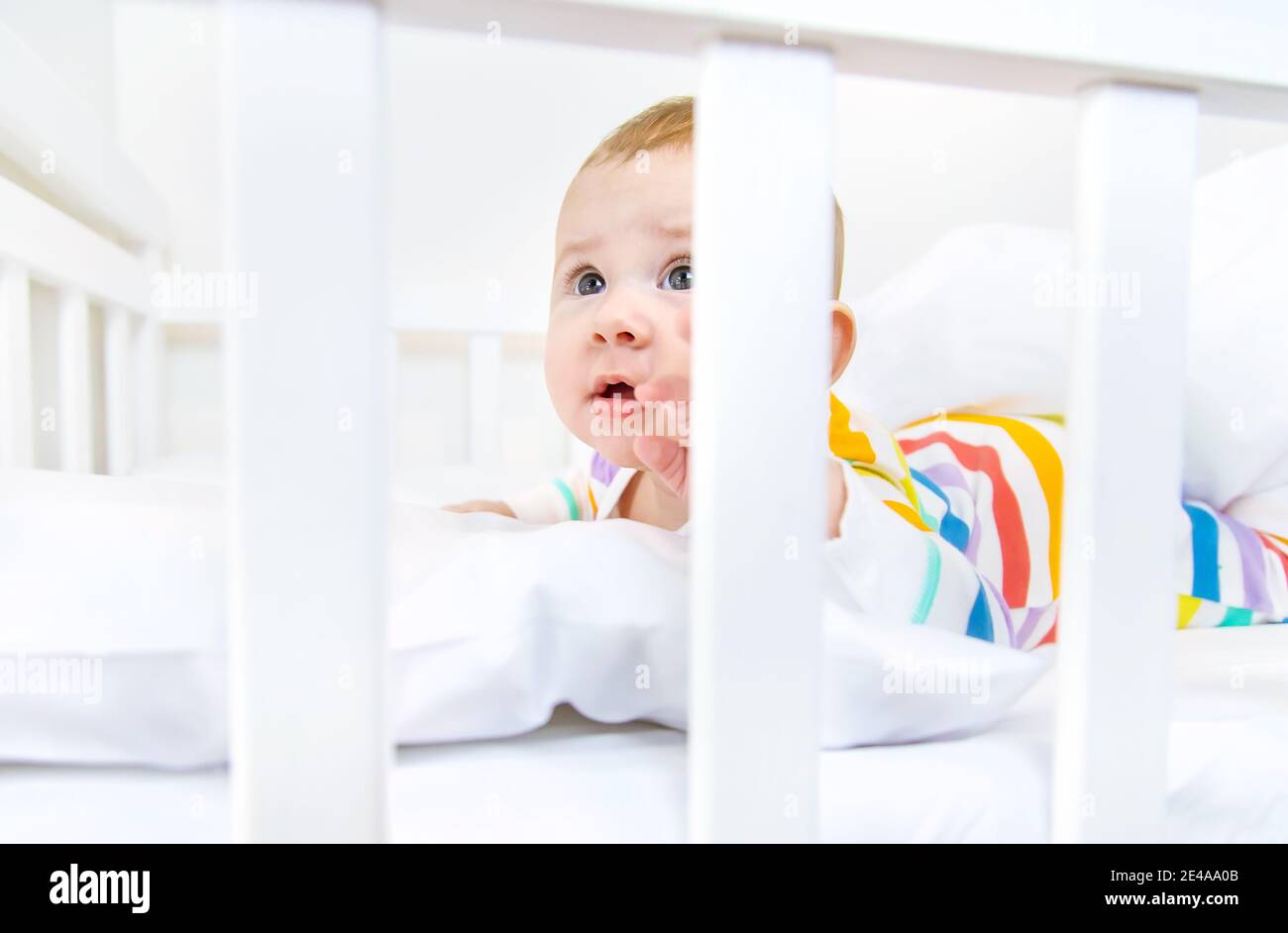 The baby in the crib goes to bed. Selective focus. People Stock Photo