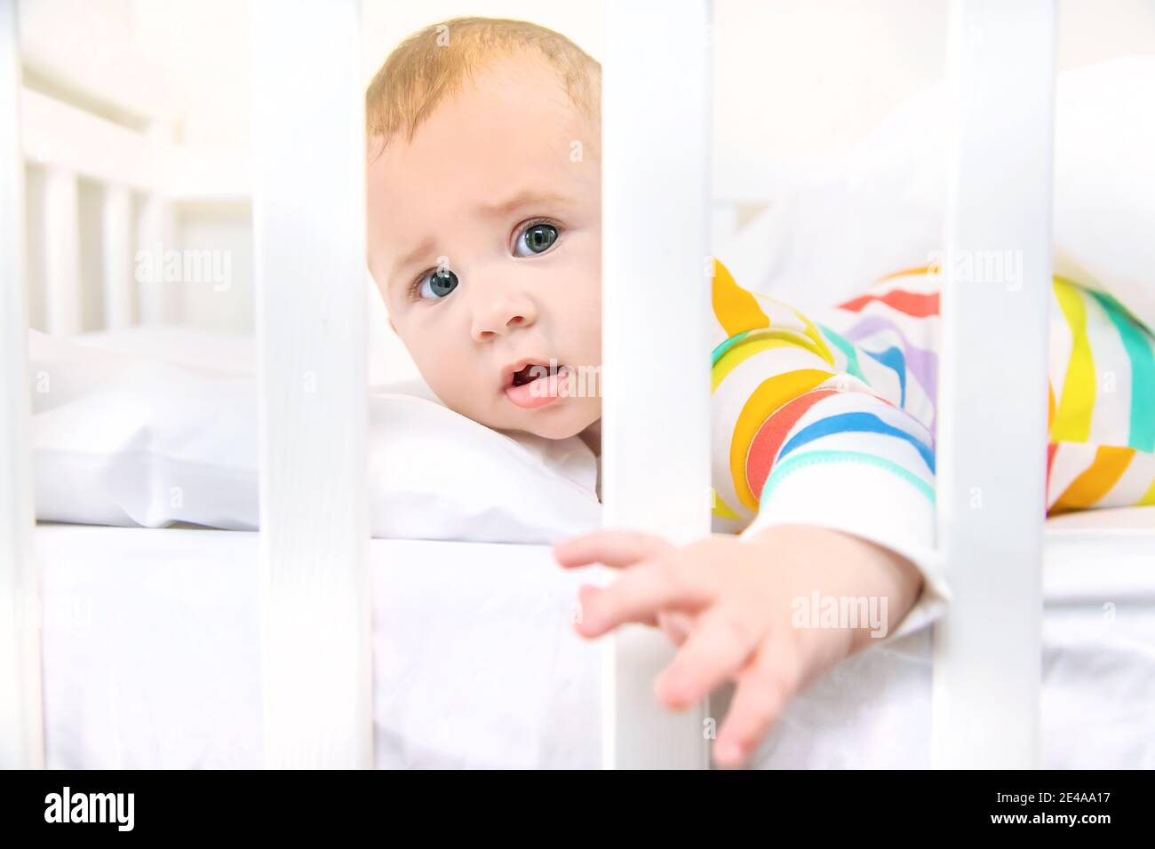 The baby in the crib goes to bed. Selective focus. People Stock Photo