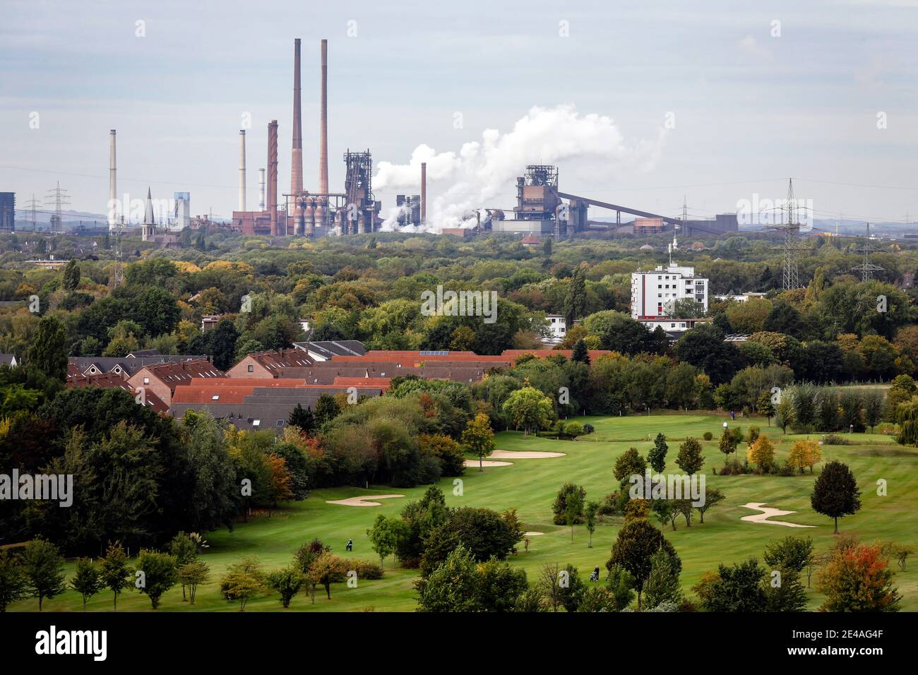 Oberhausen, Ruhr area, North Rhine-Westphalia, Germany - industrial landscape, front golf course from Golfclub Roettgersbach in Oberhausen, in back ThyssenKrupp Steel in Duisburg-Marxloh. Stock Photo