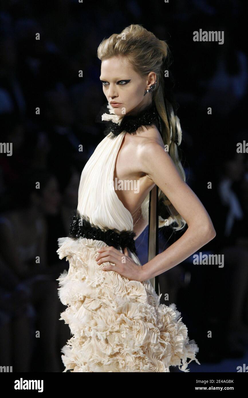 Sasha Pivovarova displays a creation by Karl Lagerfeld for Chanel