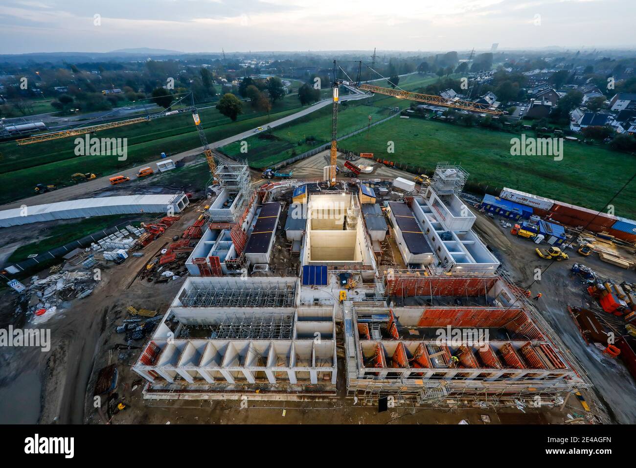 Oberhausen, Ruhr area, North Rhine-Westphalia, Germany - Emscher conversion, new construction of the Emscher AKE sewer, here the new pumping station in Oberhausen, the ecological conversion of the Emscher system consists of the construction of a central sewage treatment system in the Ruhr area, the construction of sewers and the renaturation of the Emscher and its tributaries, the dirty water river Emscher flows in the back left. Stock Photo