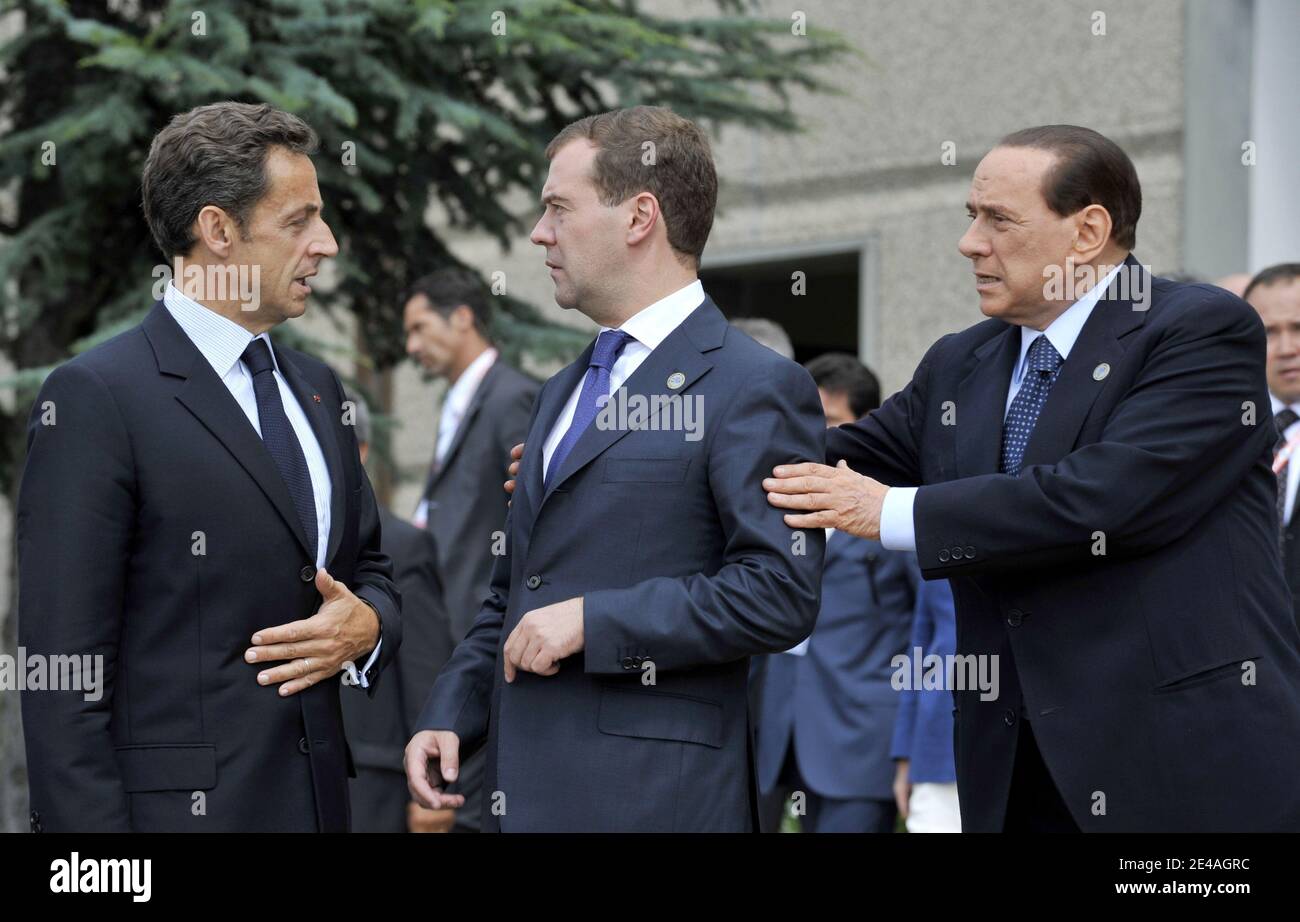 French President Nicolas Sarkozy speaks with Russian President Dmitry Medvedev and Italian Prime Minister Silvio Berlusconi after to pose for a family photo at the Guardia Di Finanza School of Coppito during G8 Summit in L'Aquila, Italy, on July 8, 2009. Photo by Christophe Guibbaud/ABACAPRESS.COM Stock Photo