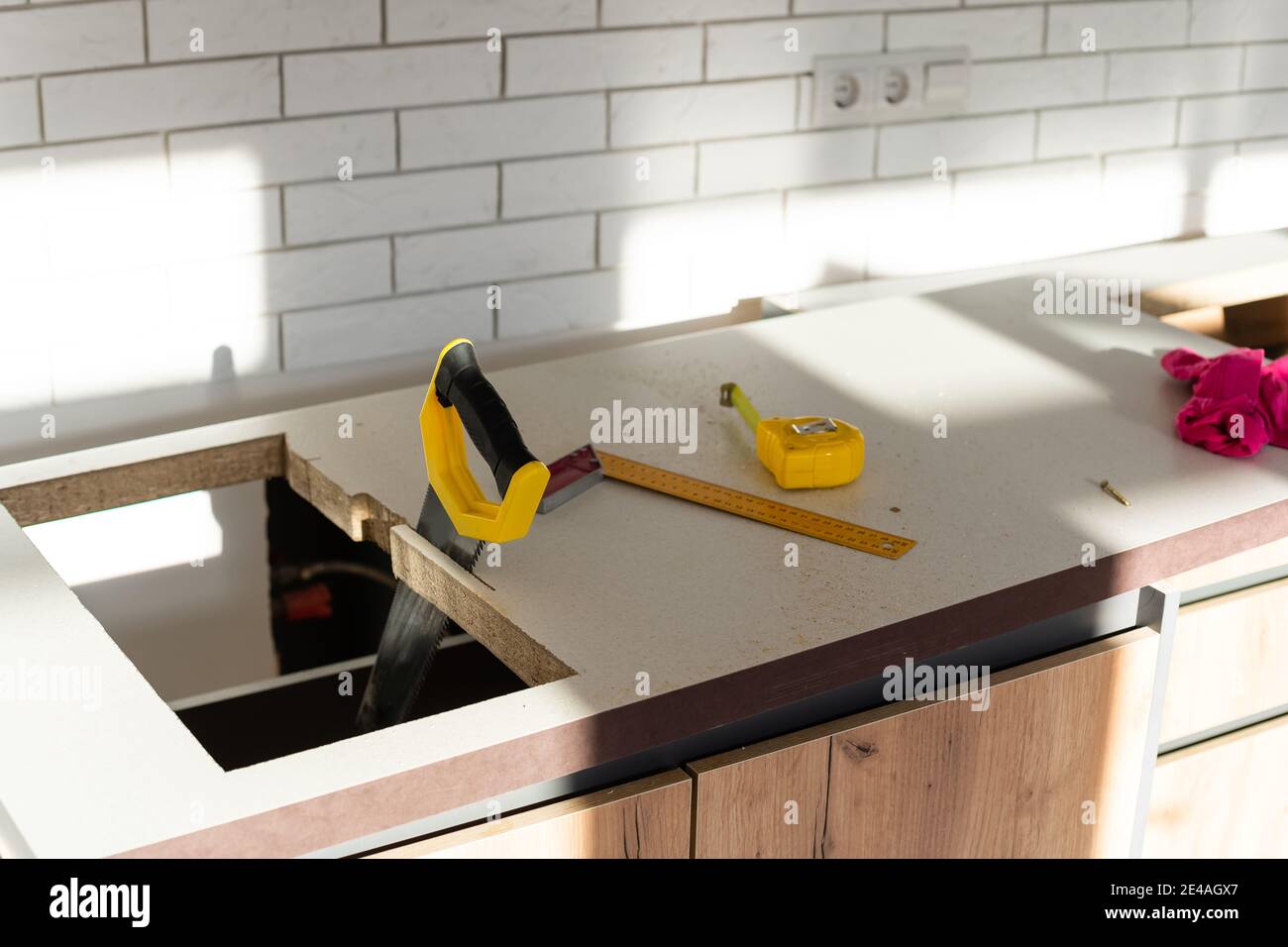to cut holes in the kitchen countertop for equipment Stock Photo Alamy