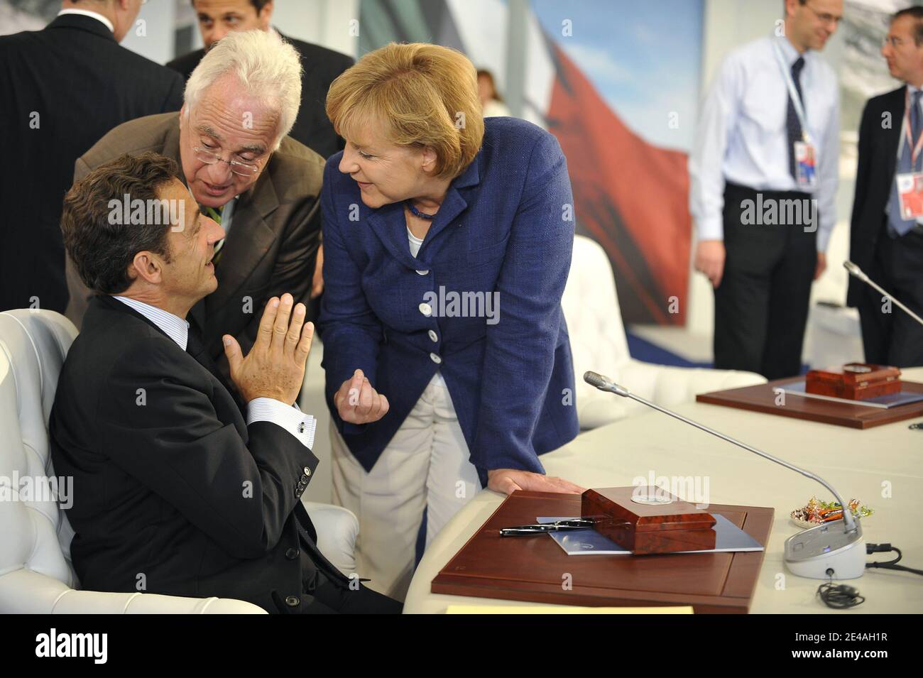 French President Nicolas Sarkozy speaks with German Chancellor Angela Merkel before a round-table discussion with the leaders of the G8 group of nations during their summit at the Guardia Di Finanza School of Coppito in L'Aquila, Italy, on July 8, 2009. Photo by Elodie Gregoire/ABACAPRESS.COM Stock Photo