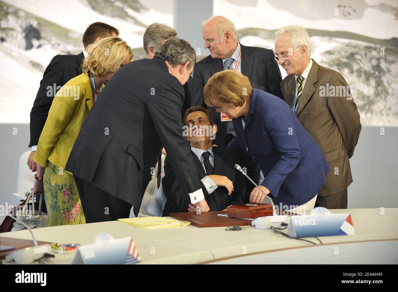 French President Nicolas Sarkozy speaks with British Prime Minister Gordon Brown and German Chancellor Angela Merkel before a round-table discussion with the leaders of the G8 group of nations during their summit at the Guardia Di Finanza School of Coppito in L'Aquila, Italy, on July 8, 2009. Photo by Elodie Gregoire/ABACAPRESS.COM Stock Photo