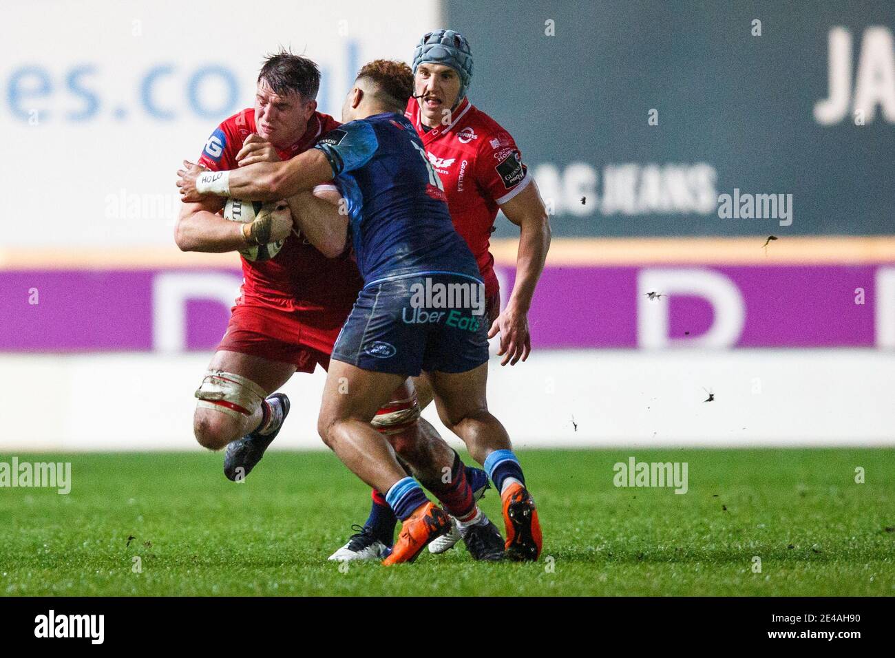 Llanelli, Wales, UK. 22 January, 2021. Scarlets flanker Ed Kennedy is tackled during the Scarlets v Cardiff Blues Guinness PRO14 Rugby Match. Credit: Gruffydd Thomas/Alamy Live News Stock Photo